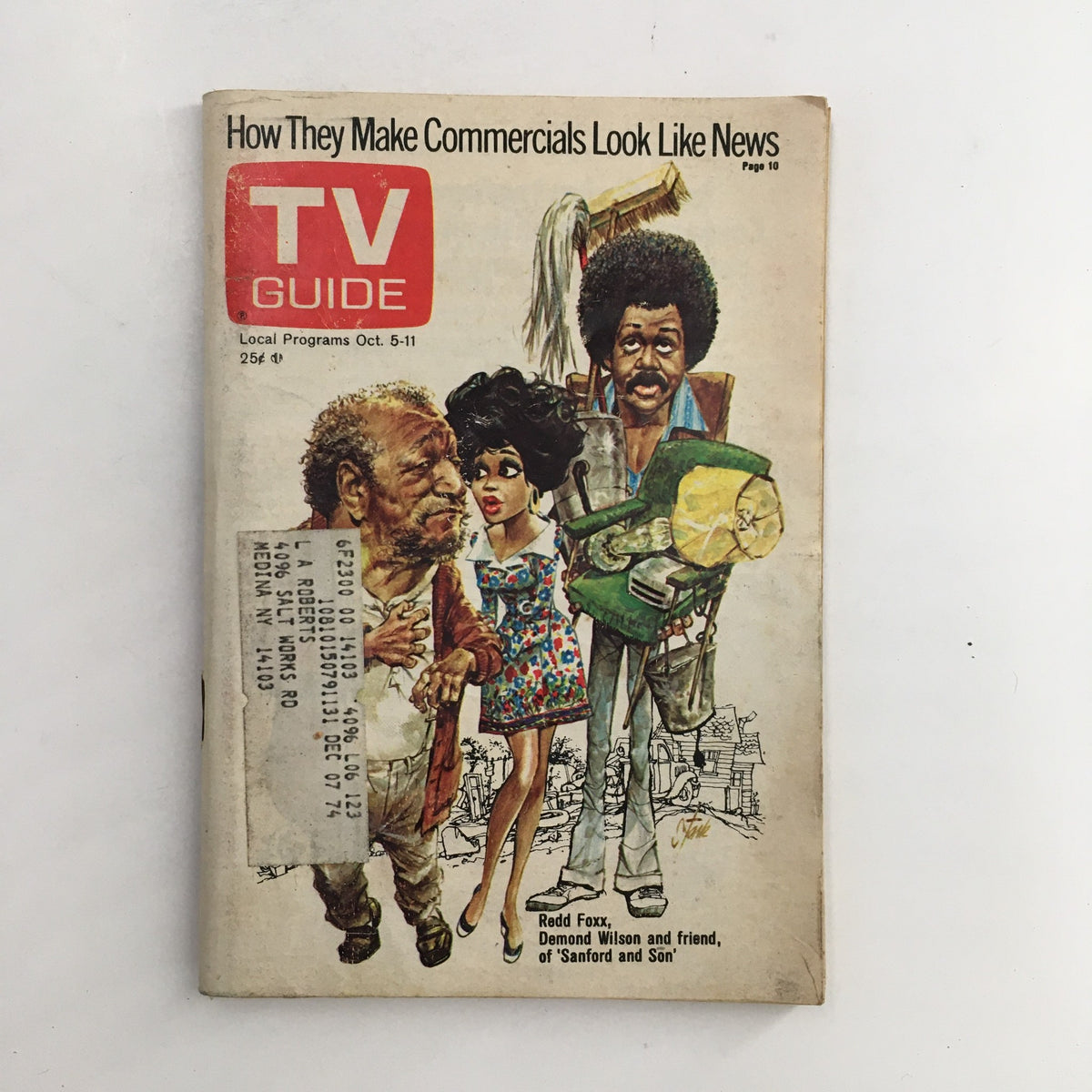 TV Guide October 5 1974 featuring Redd Foxx, Demond Wilson, and a guest, showcasing artistic cover design with characters in vibrant outfits, highlighting the theme of 'How They Make Commercials Look Like News'.