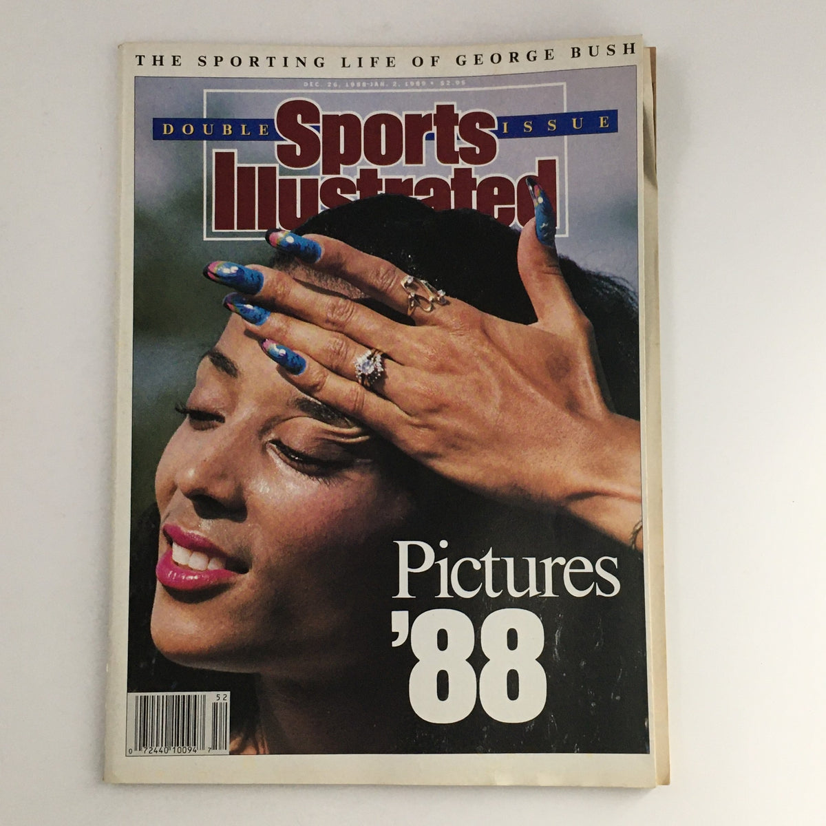 Cover of Sports Illustrated Magazine Dec 26 1988-January 2 1989 featuring a model with stylish nails, embodying the essence of sports and culture in the late 1980s.