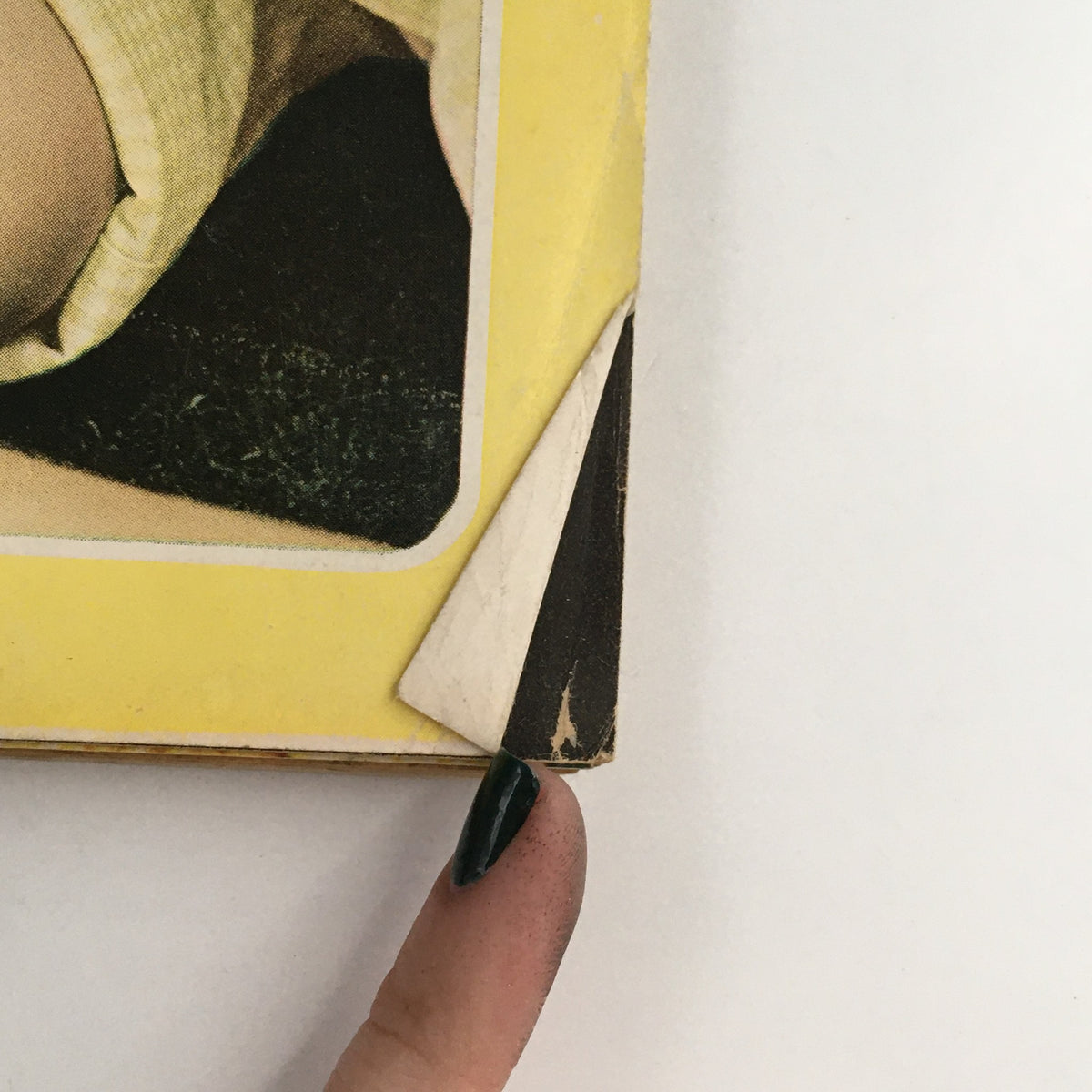 Close-up of the corner of the Good Housekeeping Magazine August 1965, showing minor wear and tear on the edges.