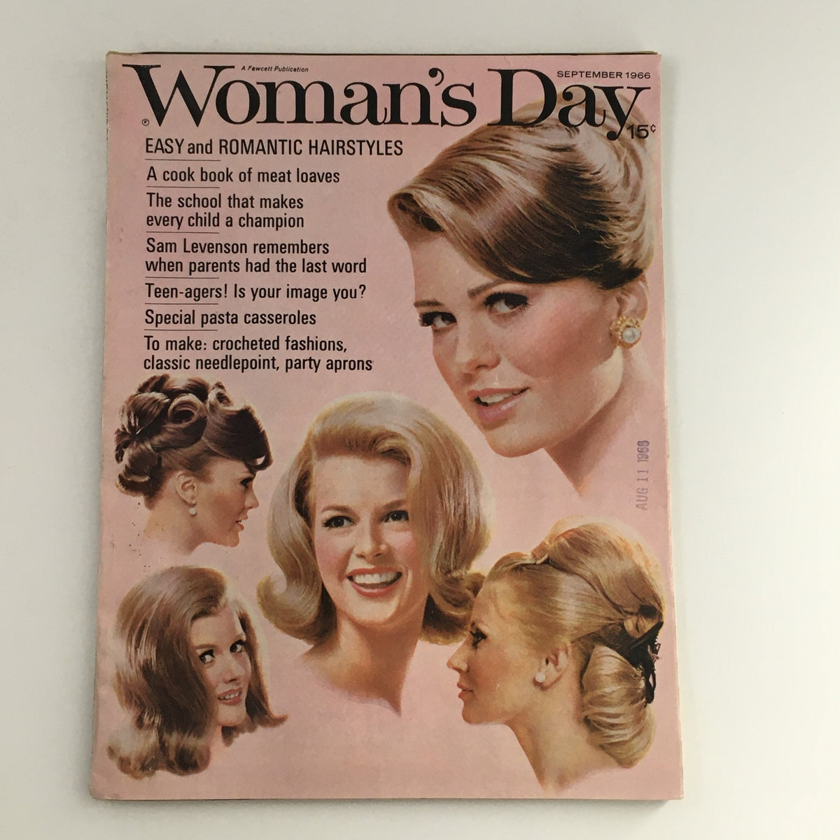 Cover of Woman's Day Magazine from September 1966 featuring easy and romantic hairstyles, with a focus on family life and parenting written by Sam Levenson. The cover showcases multiple hairstyles popular in the 1960s, reflecting the cultural essence of the era.