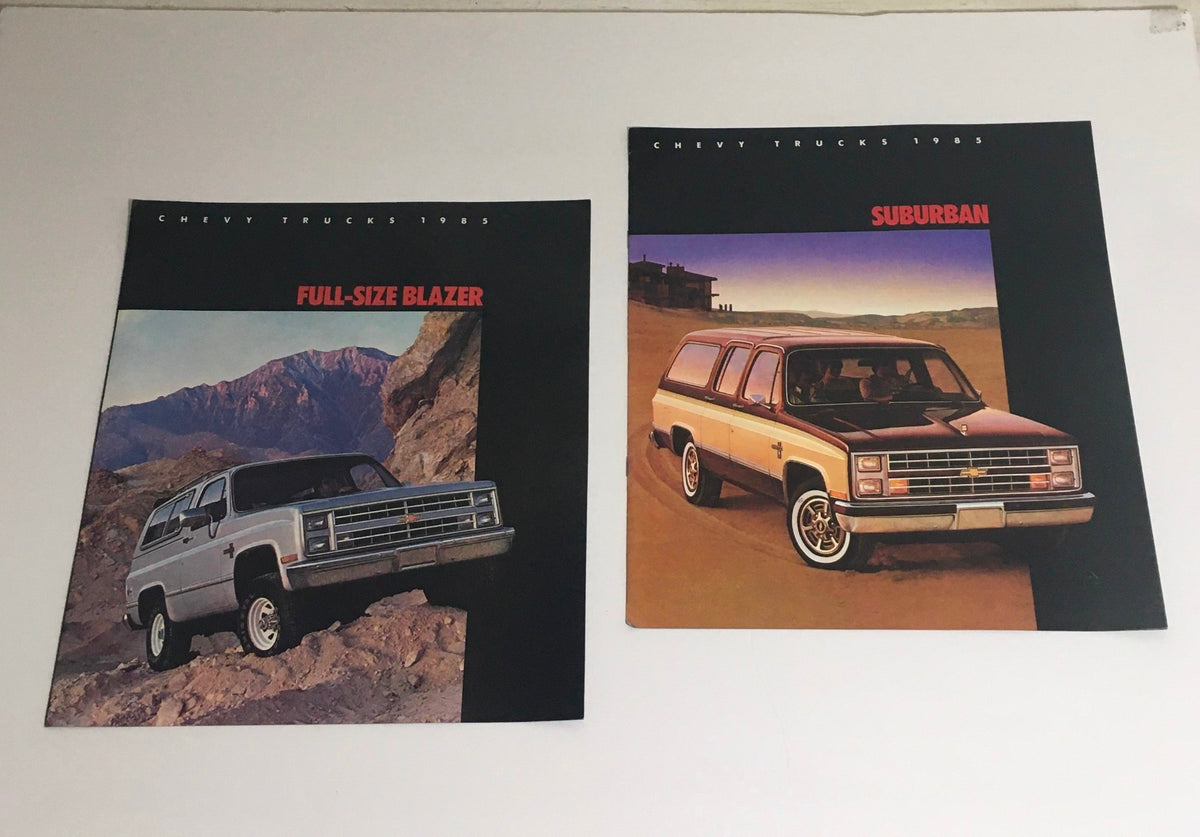 1985 Chevy Trucks Full-Size Blazer and Suburban dealership brochure showcasing rugged design in scenic landscape.