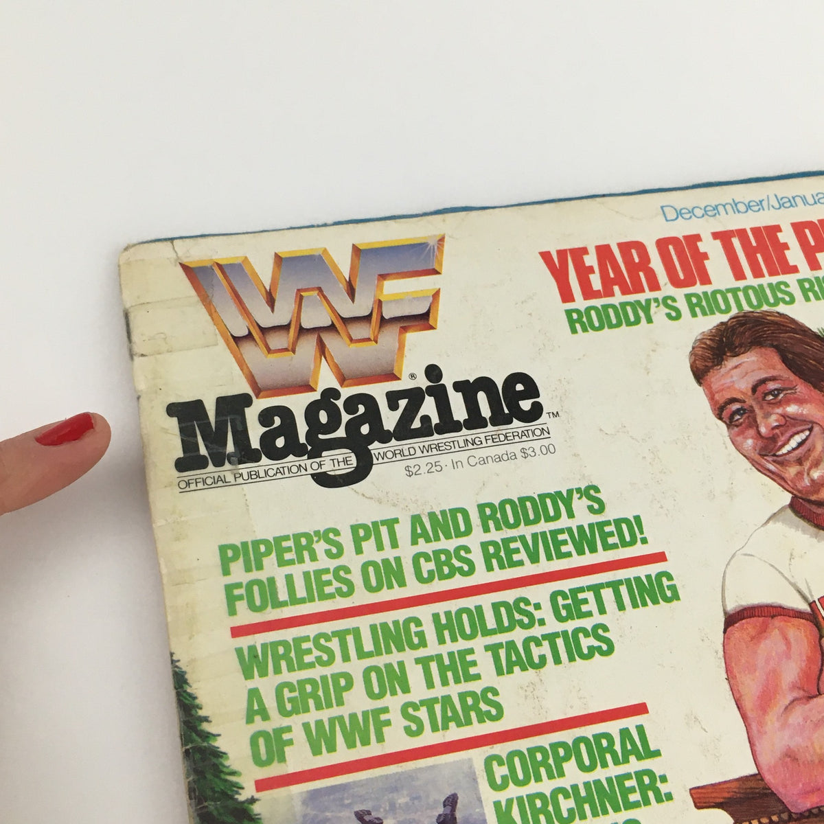 WWF Magazine December '85-January 1986 cover featuring Piper Roddy and highlights from the professional wrestling world.