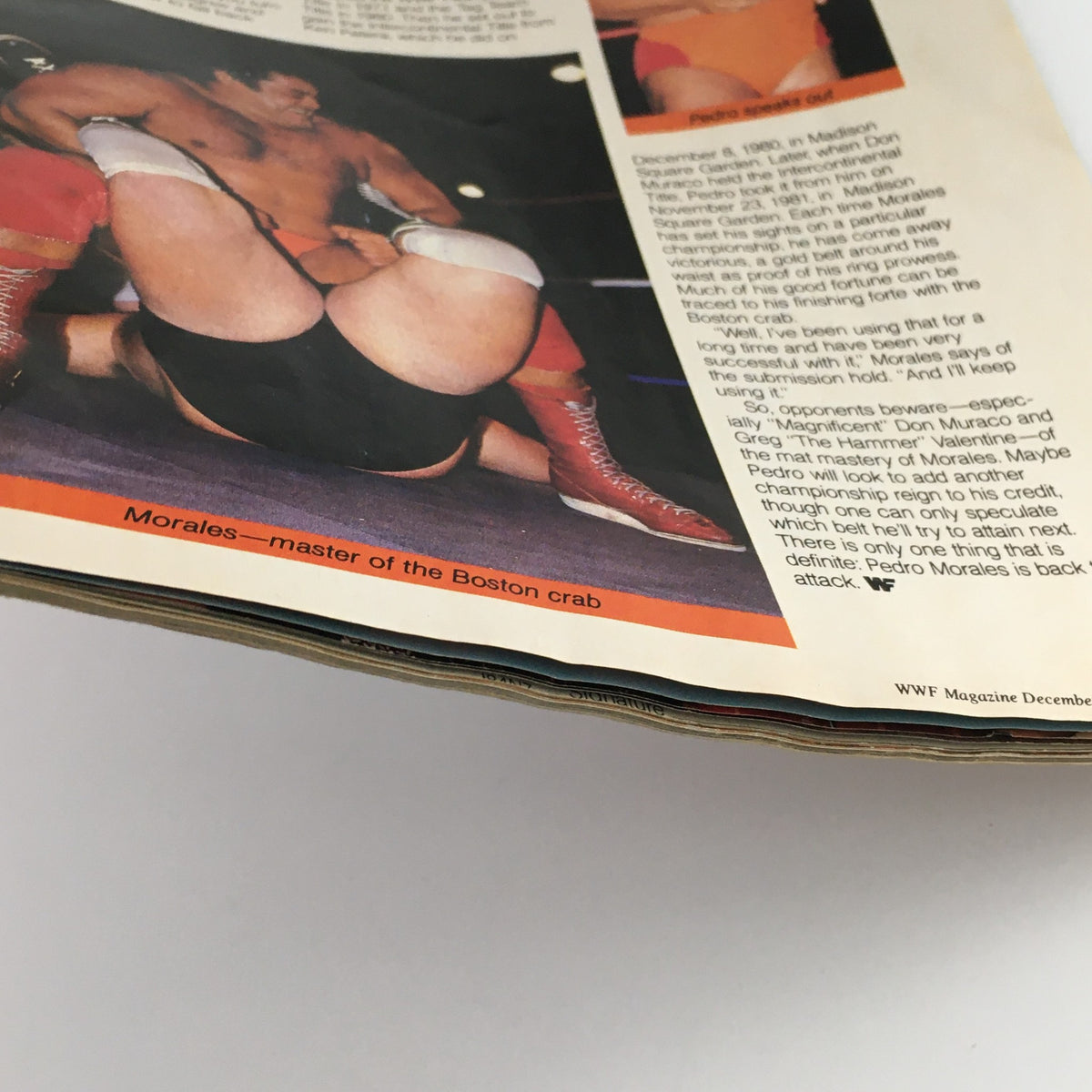 Inside page of WWF Magazine December '85-January 1986 showcasing Pedro Morales performing the Boston crab submission hold.