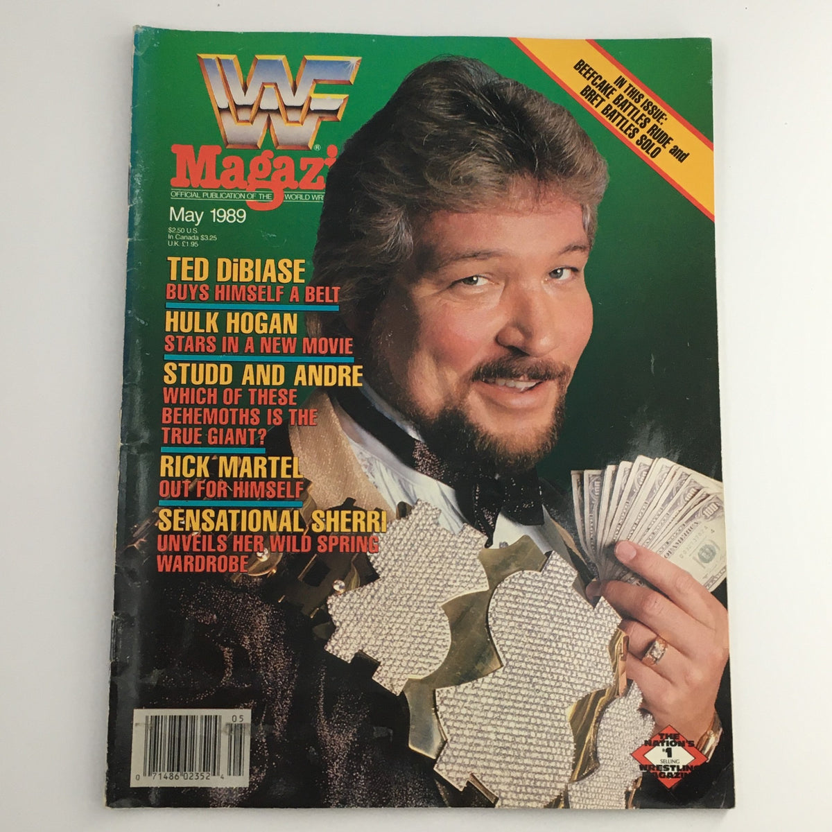 Cover of WWF Magazine from May 1989 featuring Ted DiBiase holding money, with headlines about Hulk Hogan, Big John Studd, and Andre the Giant.