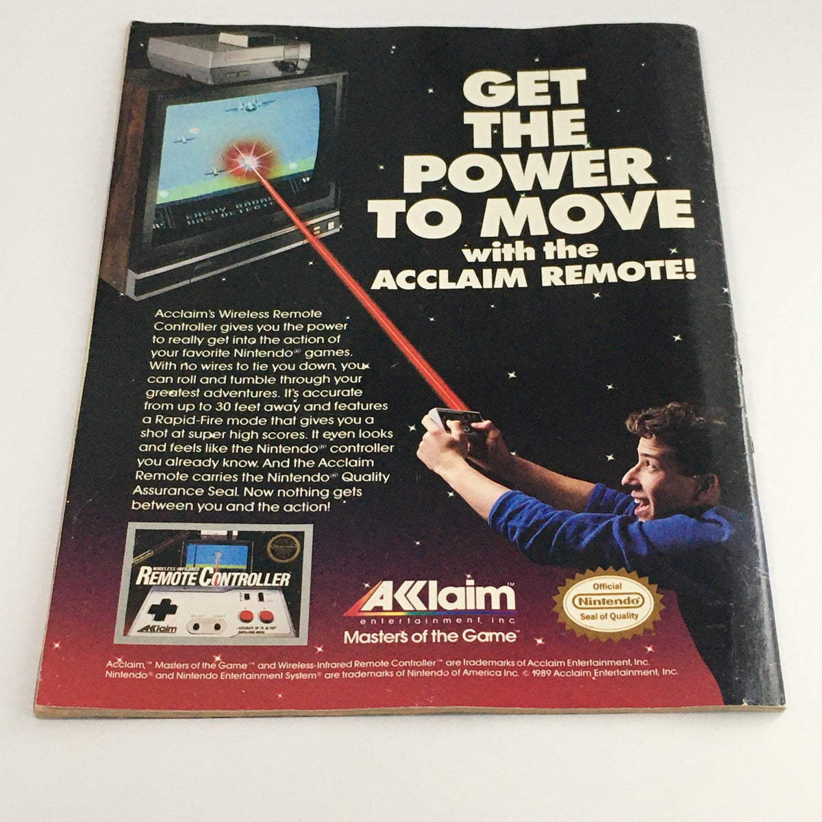 Back cover advertisement of WWF Magazine May 1989 promoting Acclaim's Wireless Remote Controller for Nintendo games with a visually dynamic image.