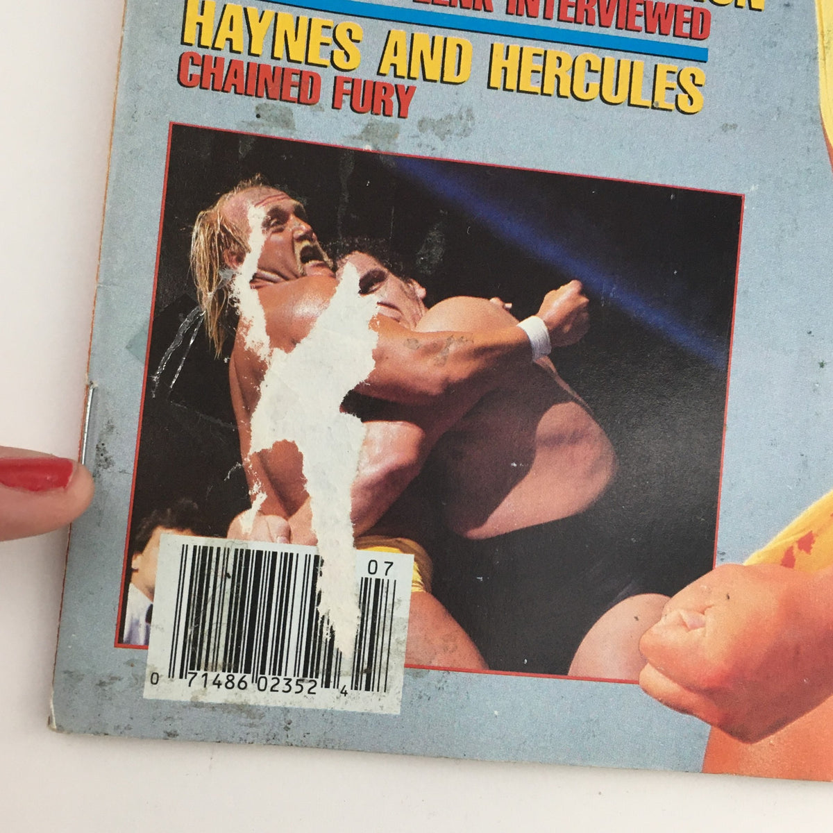 Back cover of WWF Magazine July 1987 showcasing a wrestling action shot of Hulk Hogan and another wrestler, along with promotional details about Haynes and Hercules.