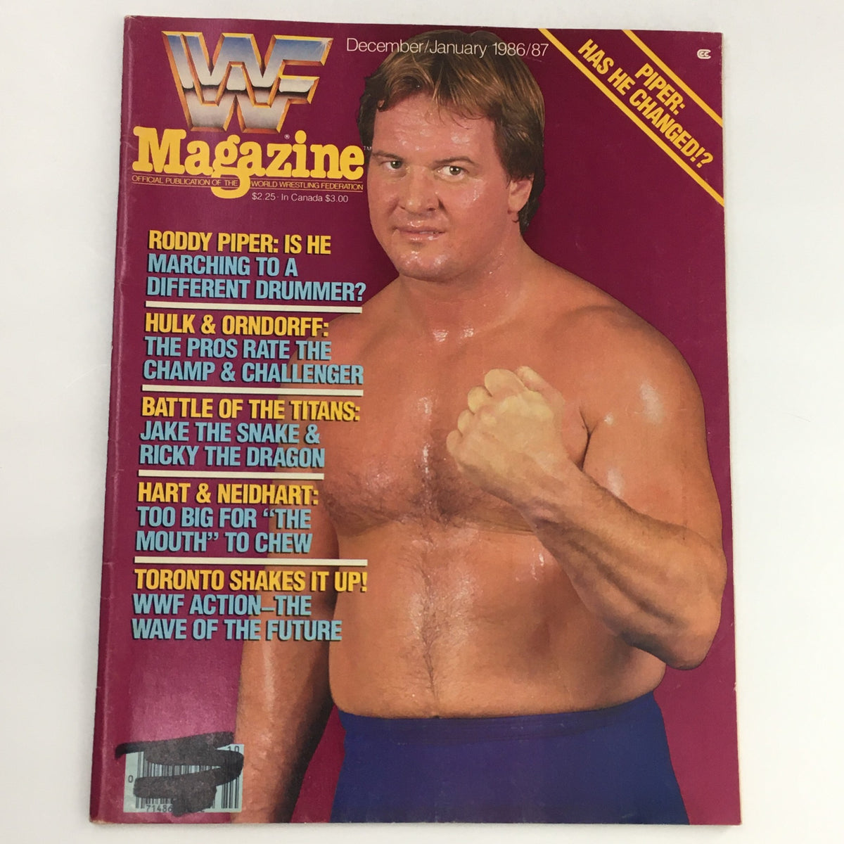 WWF Magazine December 1986 featuring Roddy Piper on the cover with headlines about Hulk Hogan and Jake The Snake, highlighting vintage wrestling culture.