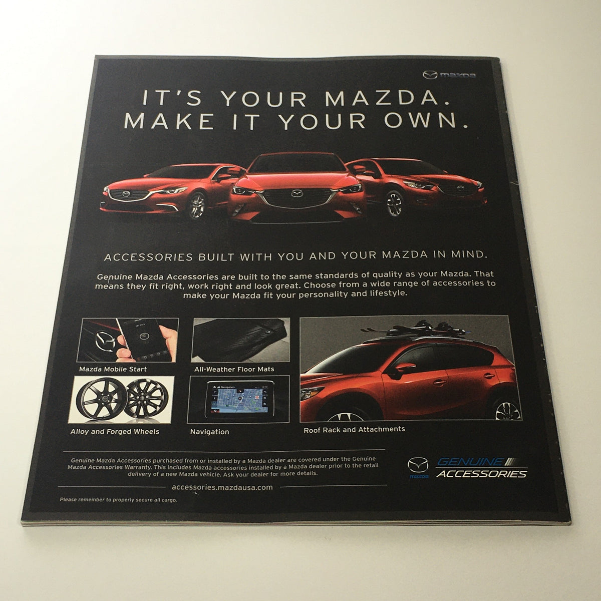Spring 2016 Mazda RX-Vision CX-9 Debuts dealership car catalog brochure page promoting genuine Mazda accessories, showcasing various vehicle enhancements designed with Mazda in mind.
