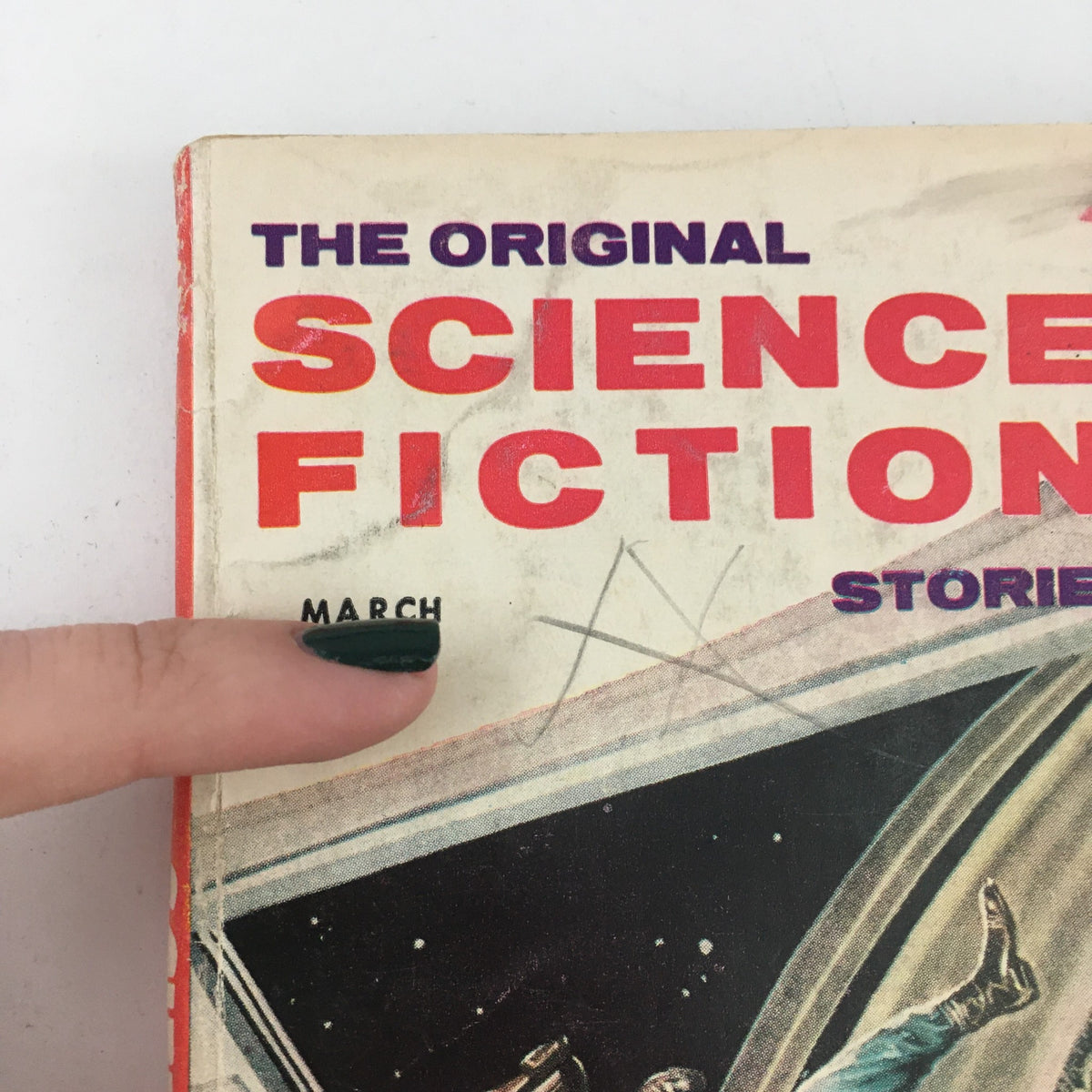 Close-up view of The Original Science Fiction Stories March 1957 magazine emphasizing the printed month 'March' and distinctive design of the cover.