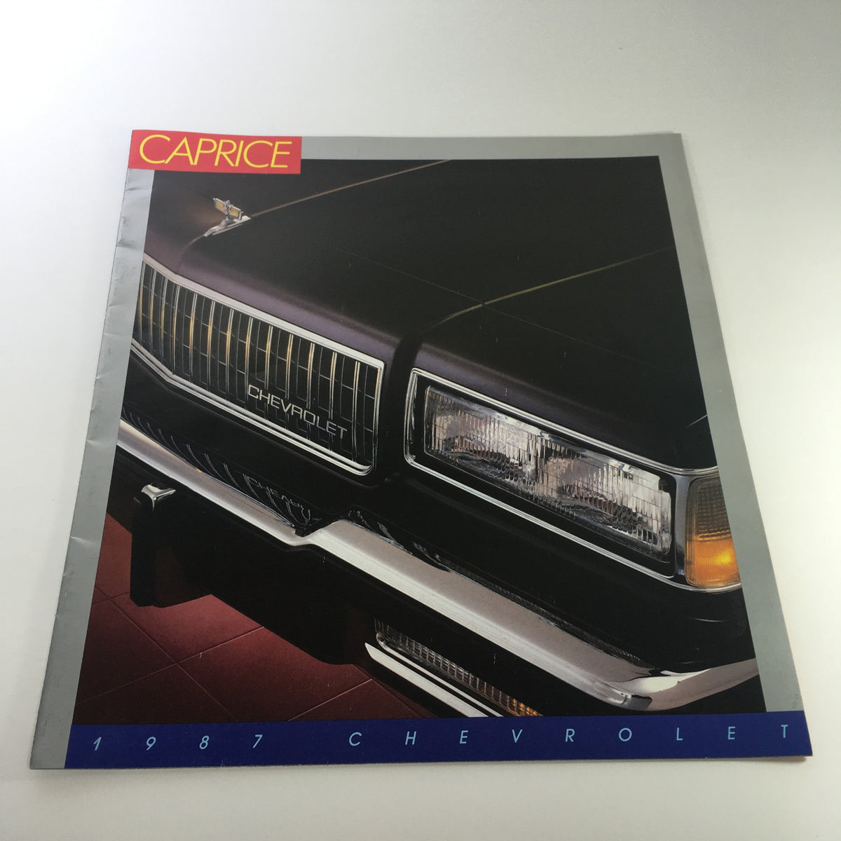 1987 Chevrolet Caprice Dealership Brochure displaying the signature front grille and headlights.