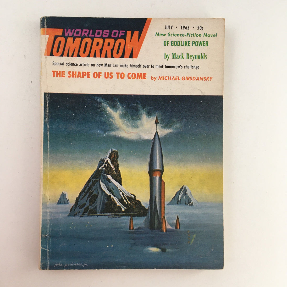Cover of Worlds of Tomorrow Science Fiction magazine from July 1965 featuring the novel Of Godlike Power by Mack Reynolds, illustrated with a rocket and mountainous landscape, highlighting themes of speculative fiction.