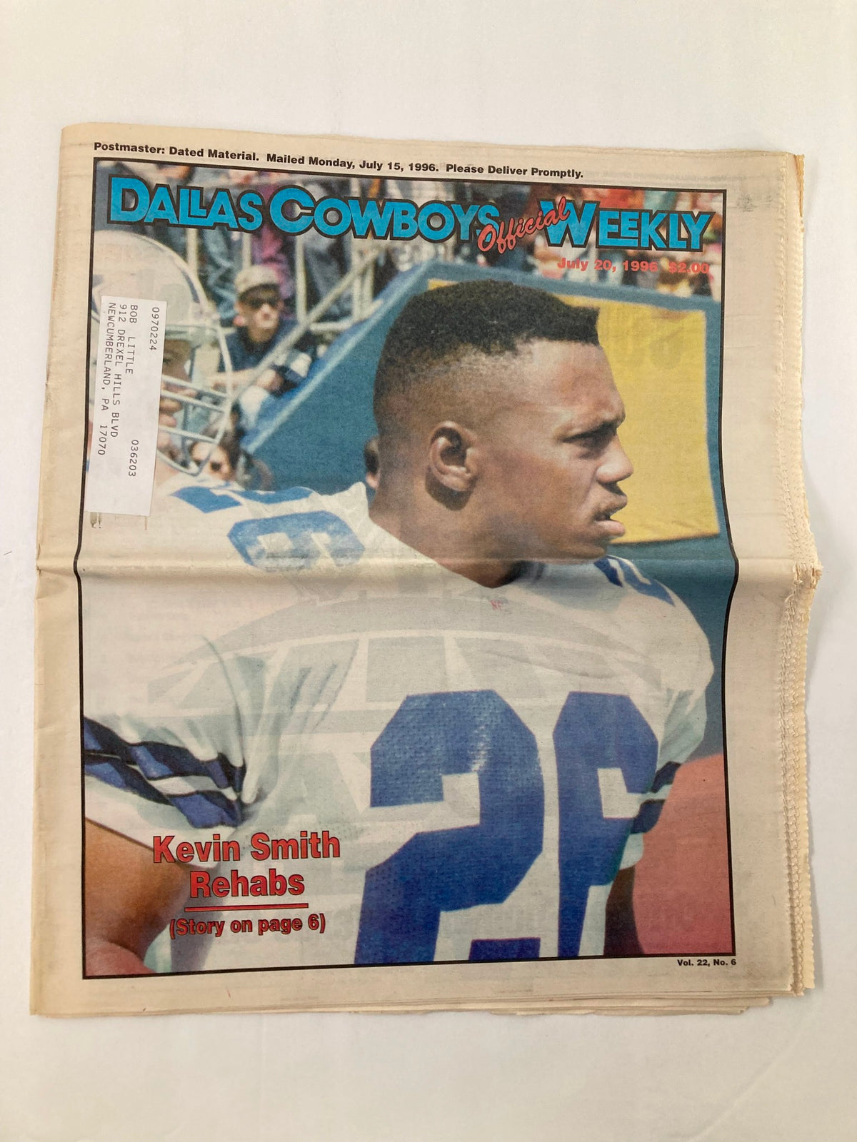 Dallas Cowboys Weekly Newspaper dated July 20, 1996, Volume 22, Issue 6 featuring Kevin Smith on the cover who is rehabbing, image displays the newspaper's front cover with a photo of Kevin Smith.