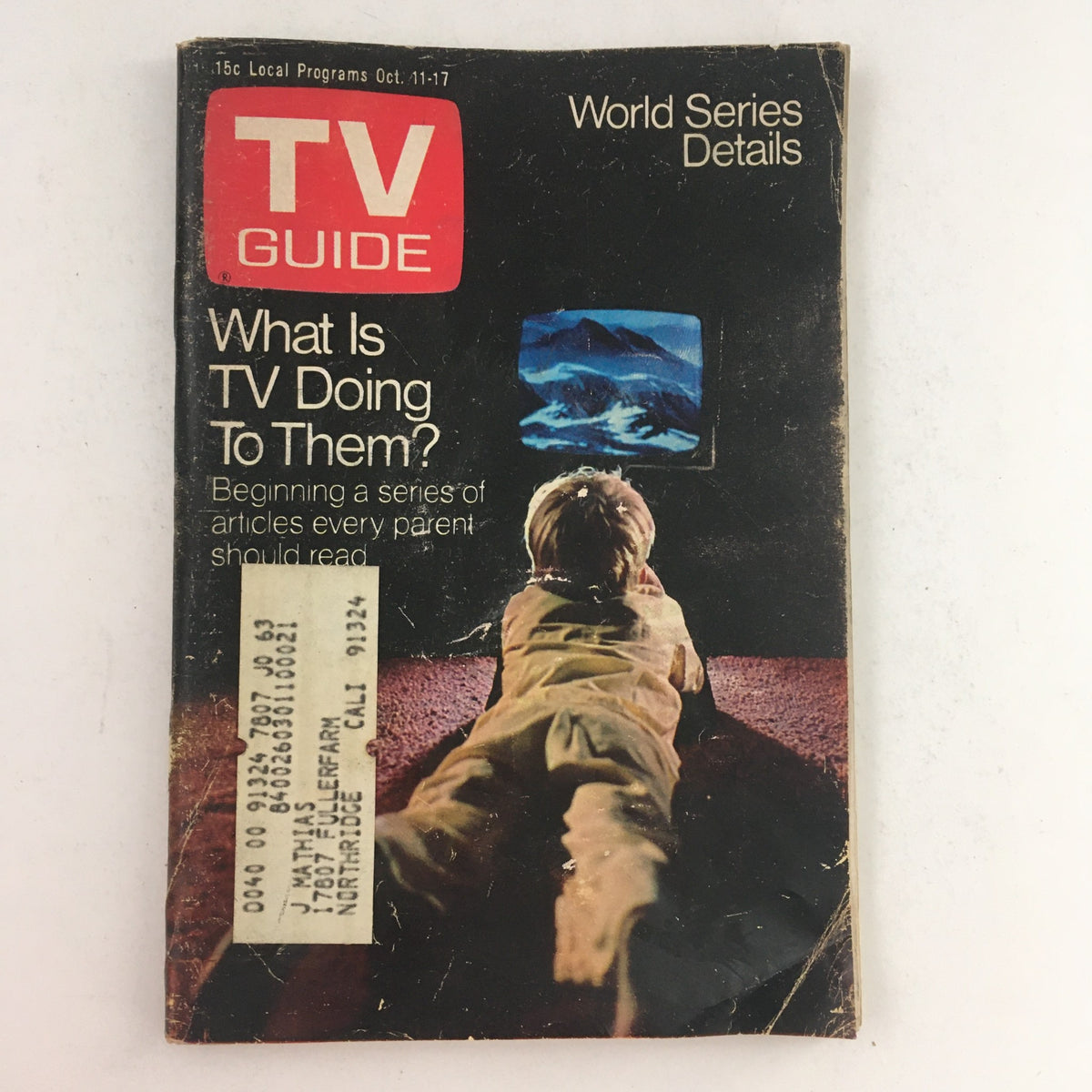 Cover of TV Guide dated October 11, 1969, Volume 17, Issue 41, featuring the headline 'What Is TV Doing To Them?' with an image of a child watching television. This edition includes World Series details and is a collectible for vintage magazine enthusiasts.