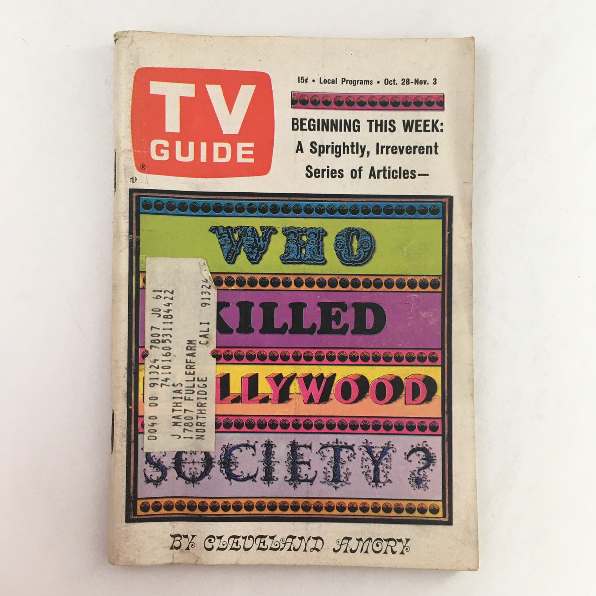 Cover of TV Guide from October 28, 1967, Vol 15 #43 featuring the intriguing title 'Who Killed Hollywood Society' with colorful graphics. This vintage magazine highlights the cultural context of television during the 1960s, showcasing minor wear and an address label that adds character.