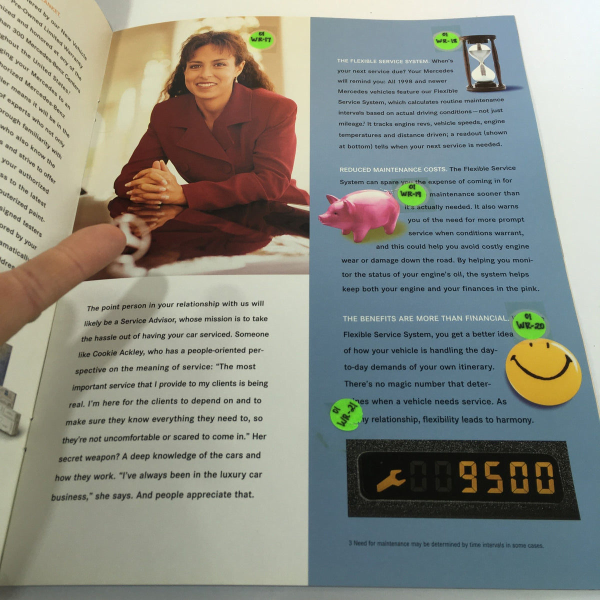 Image from the 2000 Mercedes-Benz Welcome Lease and Finance The Collection Dealership Catalog showing a service advisor with a pink background, emphasizing customer service and maintenance costs.