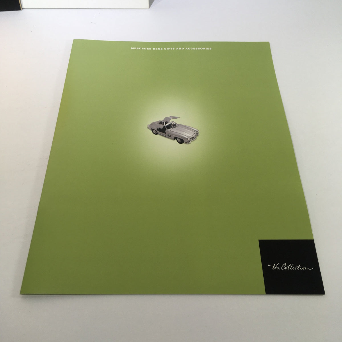 2000 Mercedes-Benz Welcome Lease and Finance The Collection Dealership Catalog cover with a minimalistic design featuring a classic car illustration, promoting luxury vehicle accessories.