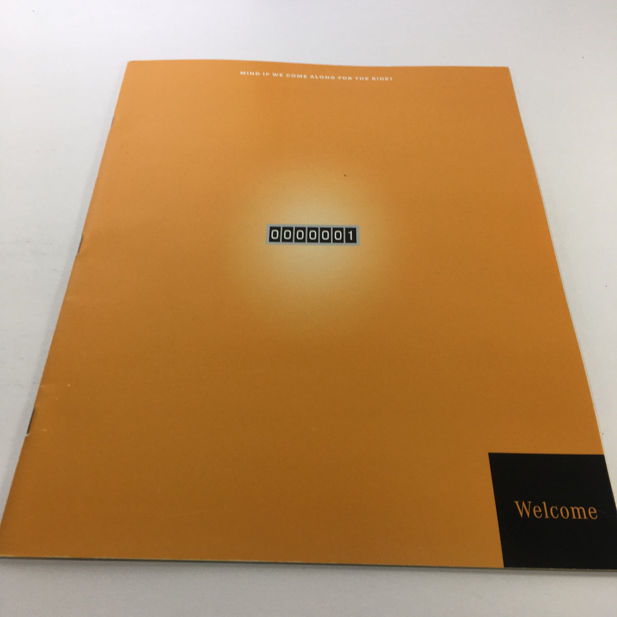 2000 Mercedes-Benz Welcome Lease and Finance The Collection Dealership Catalog featuring a striking orange cover with a unique number design, illustrating an innovative dealership concept.