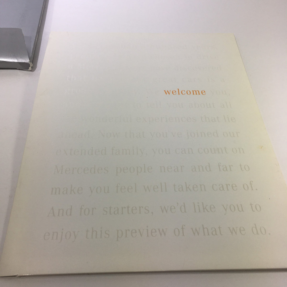Cover of the 2000 Mercedes-Benz Welcome Lease and Finance The Collection Dealership Catalog, showcasing a simple design with the word 'welcome' prominently featured.