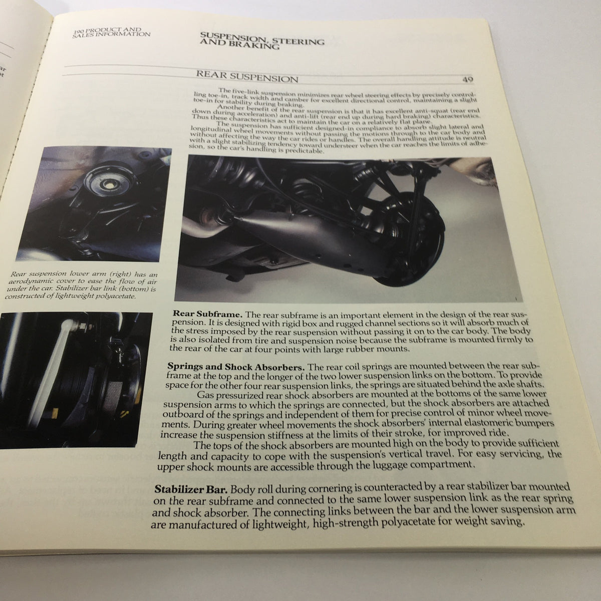 Section on rear suspension from the 1984 Mercedes-Benz 190-Class Product and Sales Information Catalog explaining design elements.