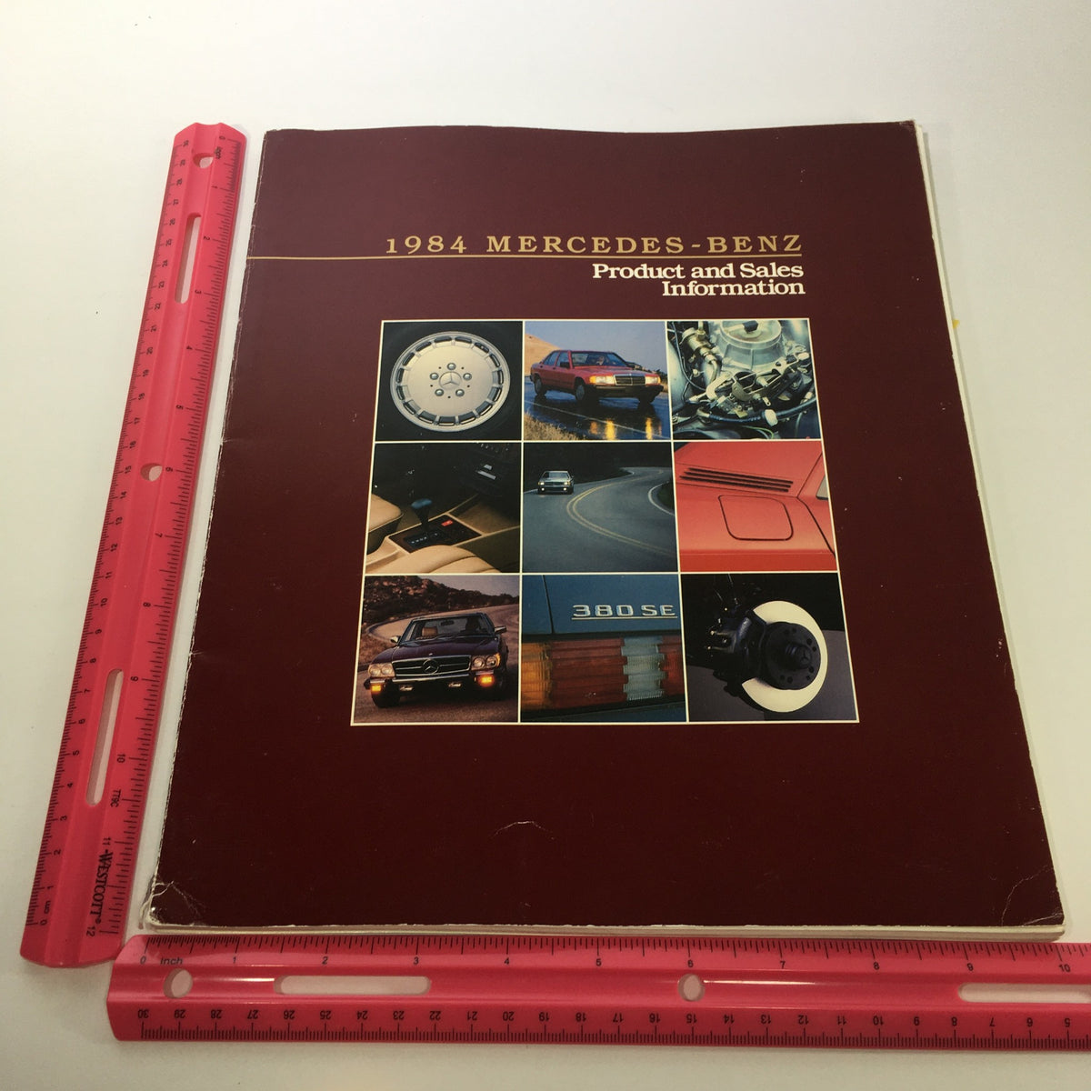 Front cover of the 1984 Mercedes-Benz 190-Class Product and Sales Information catalog with visual elements showcasing various vehicle features.
