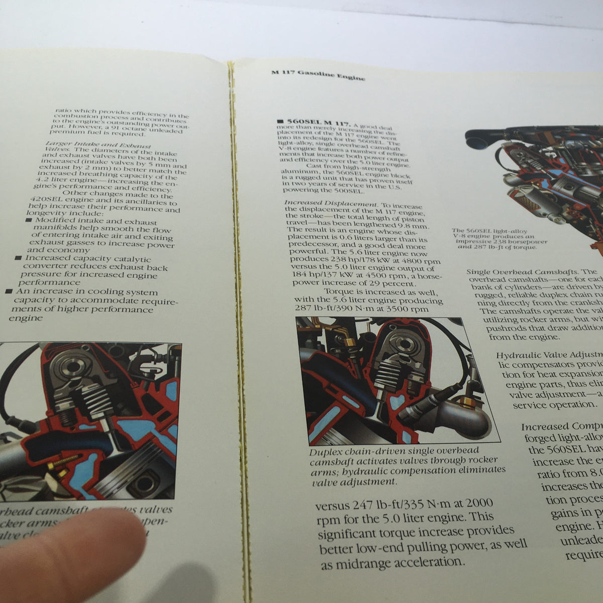 1986 Mercedes-Benz Product and Sales Information Brochure page explaining the M117 gasoline engine with detailed illustrations and text.