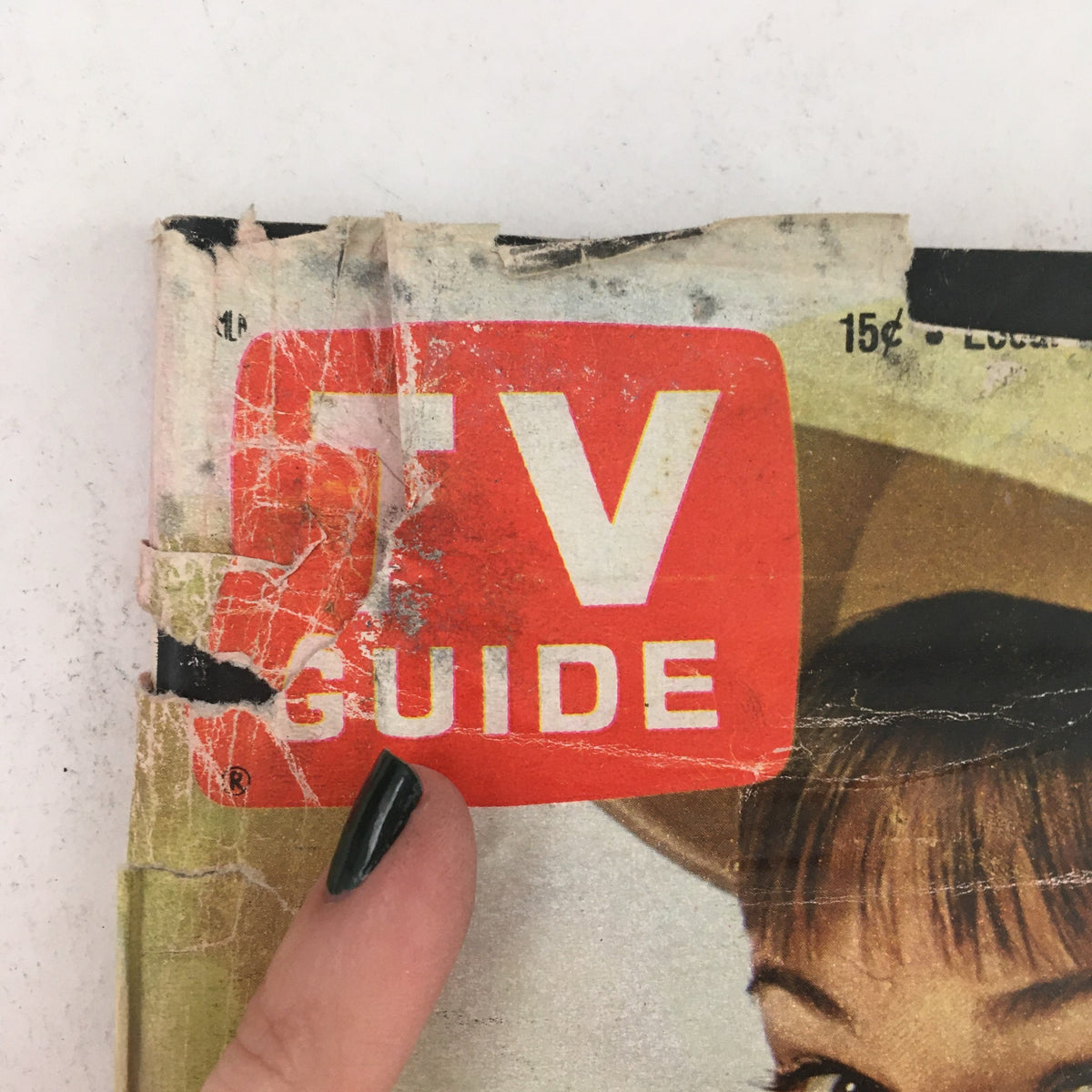 Close-up of the TV Guide logo on the cover of the September 30, 1967 issue, highlighting signs of wear and tear of this classic vintage magazine.