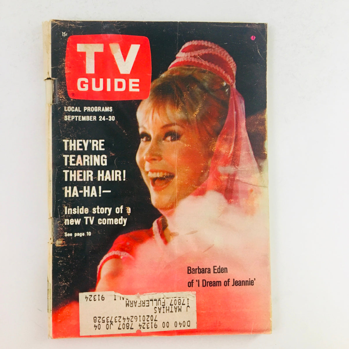 TV Guide September 24 1966 Vol 14 #39 featuring Barbara Eden on the cover, highlighting a new TV comedy. The magazine shows wear with an address label and protective covering.