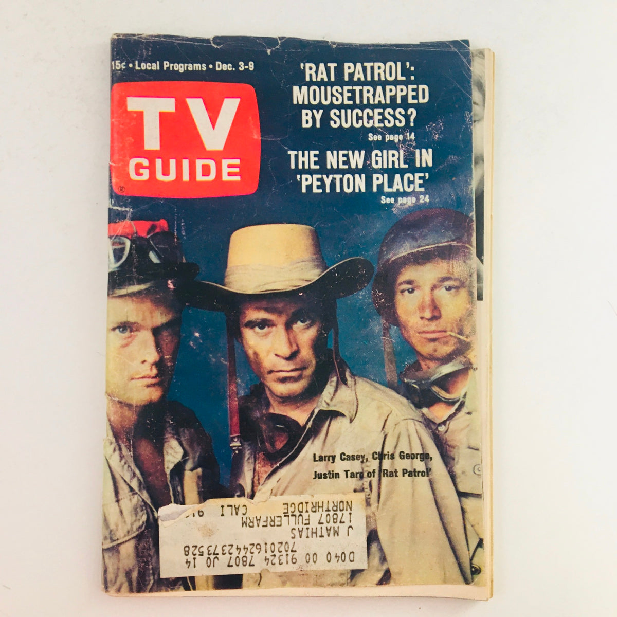 Cover of TV Guide December 3, 1966, Vol 14 #49 featuring Larry Casey, Chris George, and Justin Tarr from 'Rat Patrol' set against a vintage backdrop.