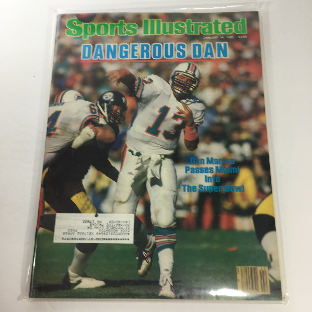 Sports Illustrated cover from January 14, 1985 featuring Dan Marino, showcasing the headline 'Dan Marino Passes Miami Into The Super Bowl'. The magazine depicts Marino in action during a football game, highlighting his pivotal role in the Miami Dolphins' success.