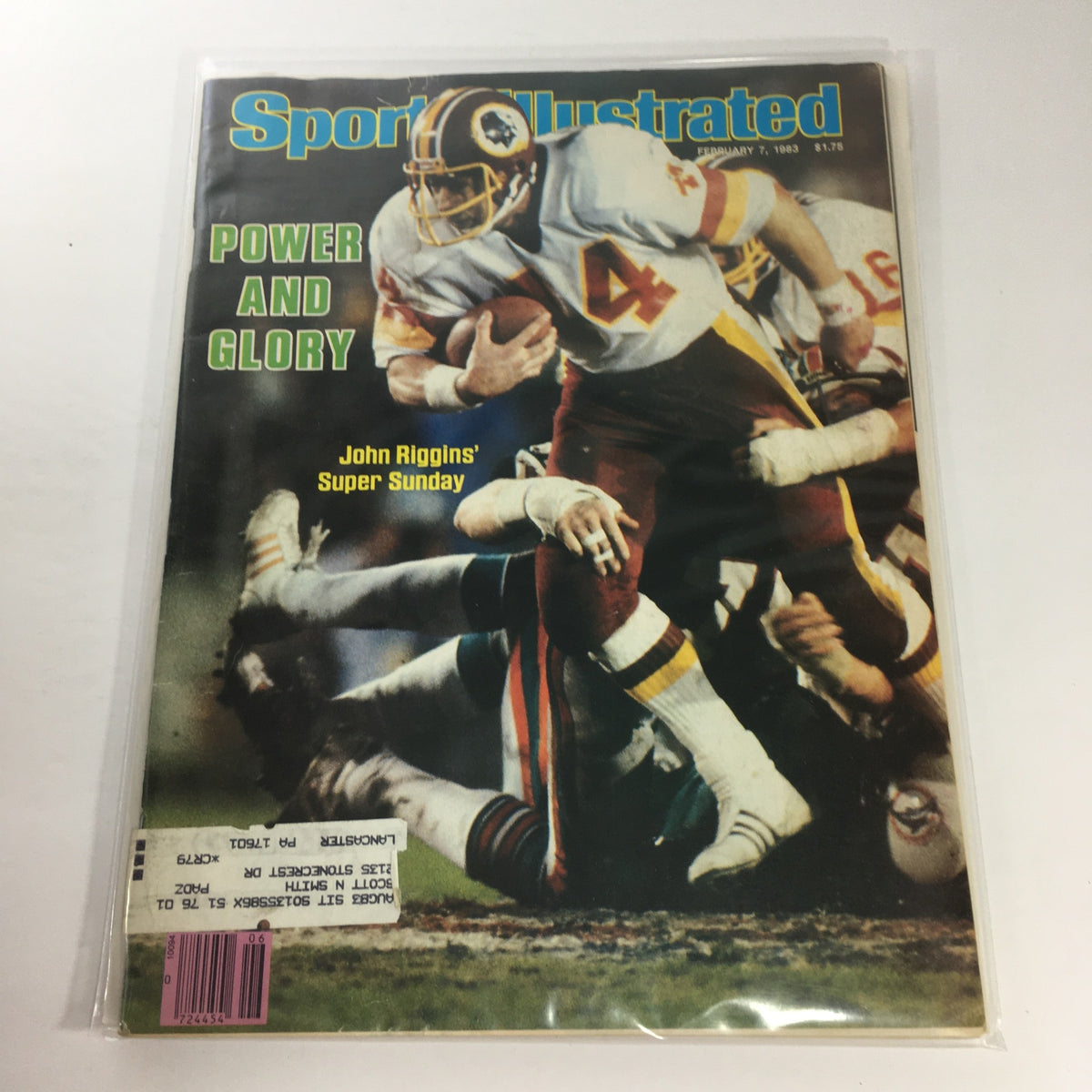 Sports Illustrated cover from February 7, 1983, featuring John Riggins in action for Super Sunday, highlighting the theme 'Power and Glory'.