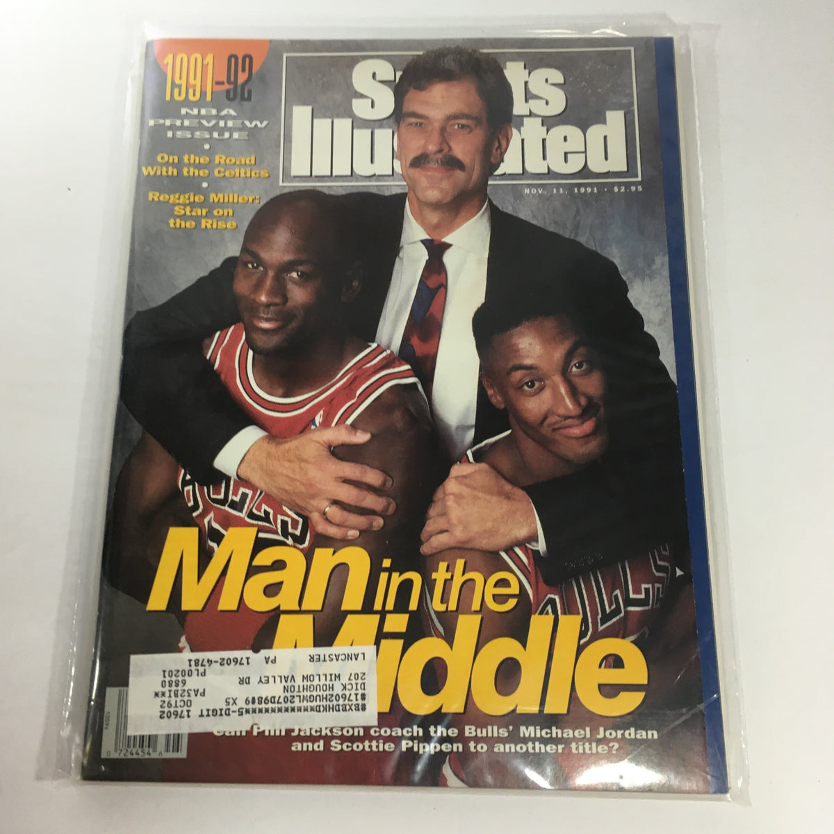 Sports Illustrated cover from November 11, 1991, featuring Michael Jordan and Scottie Pippen alongside Phil Jackson, with the headline 'Man in the Middle' and highlights of the NBA season preview.