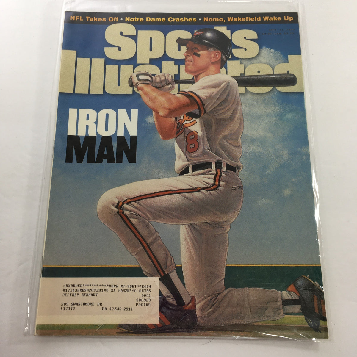 Sports Illustrated September 11 1995 cover featuring Iron Man, showcasing a baseball player ready to bat, with the title prominently displayed.
