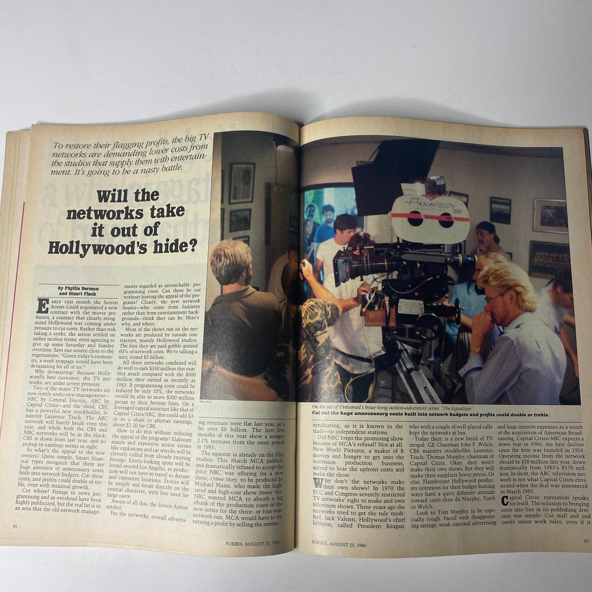 Spread from Forbes Magazine August 25, 1986, showcasing the cover story 'Will the Networks Take It Out of Hollywood's Hide?' with a scene from a film set.