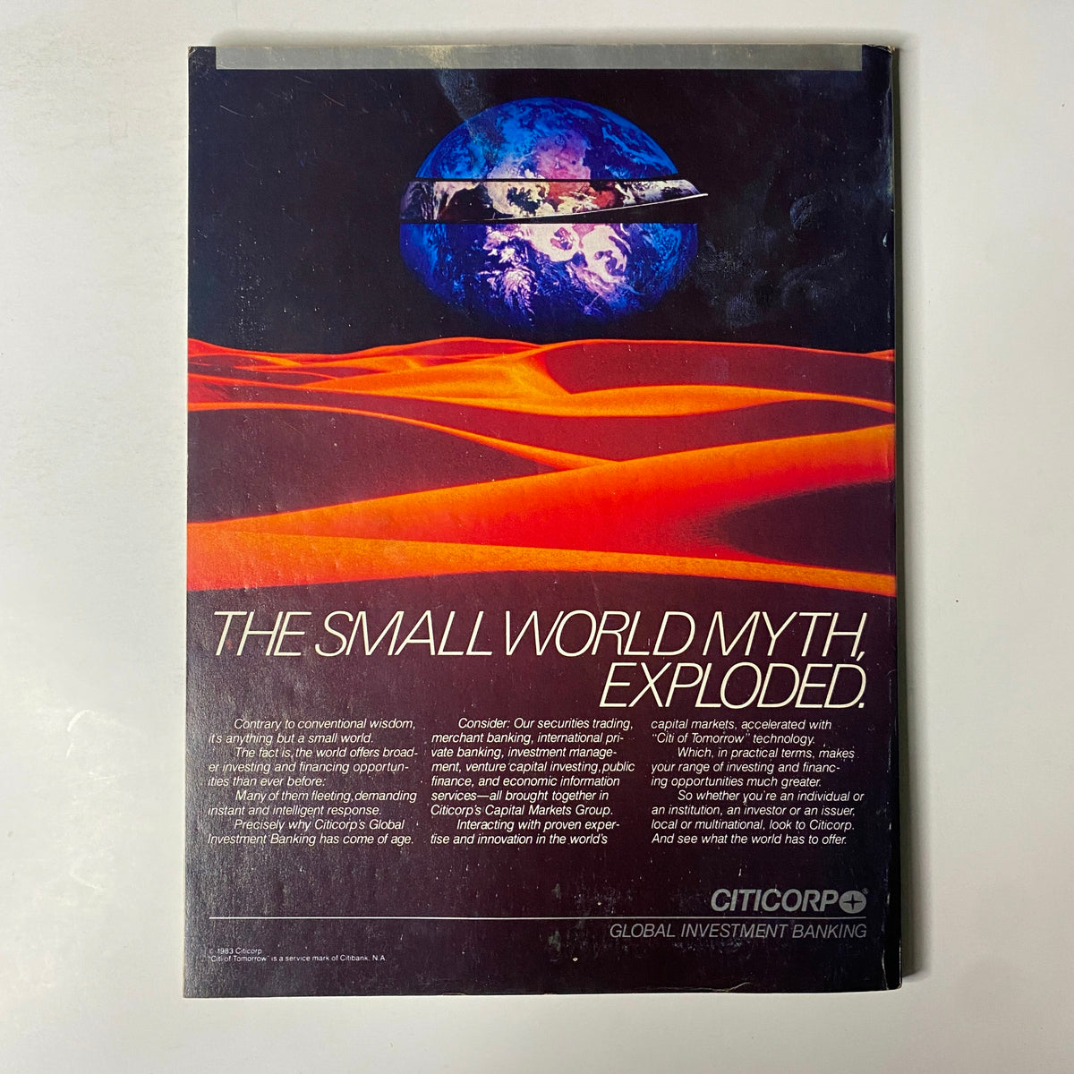 Back cover of Forbes Magazine July 4, 1983 advertising Citicorp Global Investment Banking with a striking visual of Earth and a desert landscape.