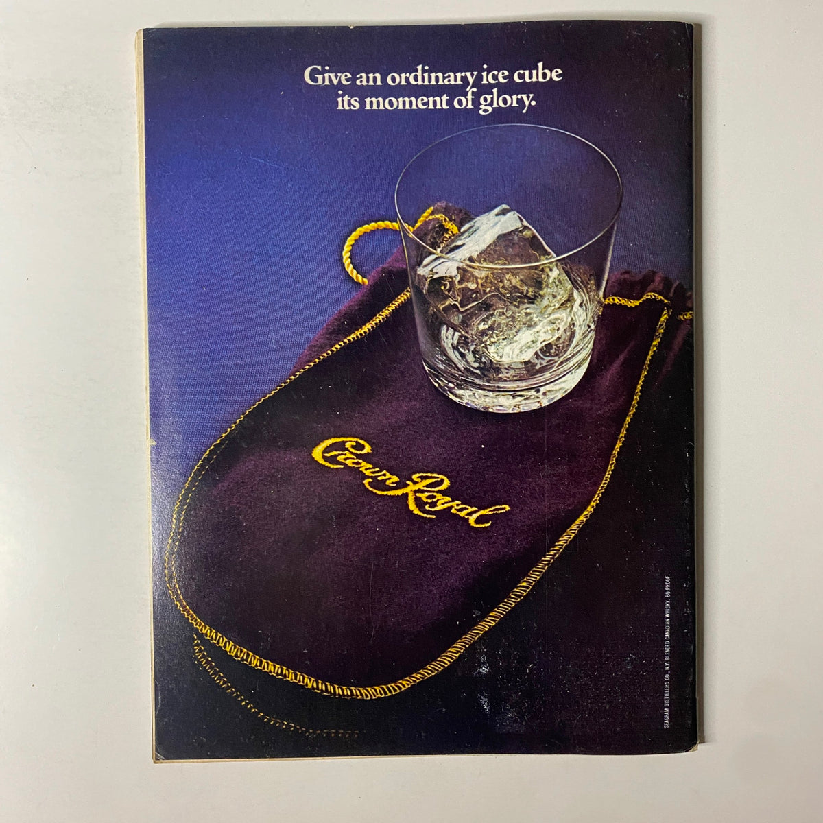 Forbes Magazine February 16, 1981 showcasing an advertisement for Crown Royal whiskey, emphasizing the tagline 'Give an ordinary ice cube its moment of glory'.