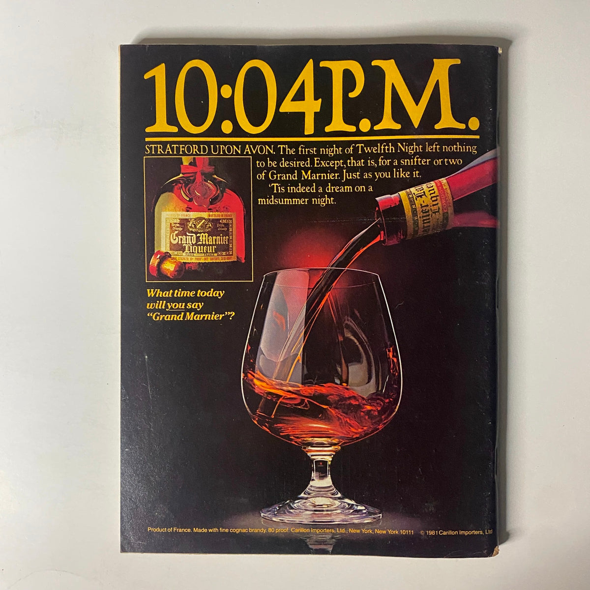 Forbes Magazine October 12, 1981, featuring the headline '10:04 P.M.' with an advertisement for Grand Marnier, showcasing a glass with a pour of the drink alongside the product bottle and descriptive text about enjoying Grand Marnier on a midsummer night.