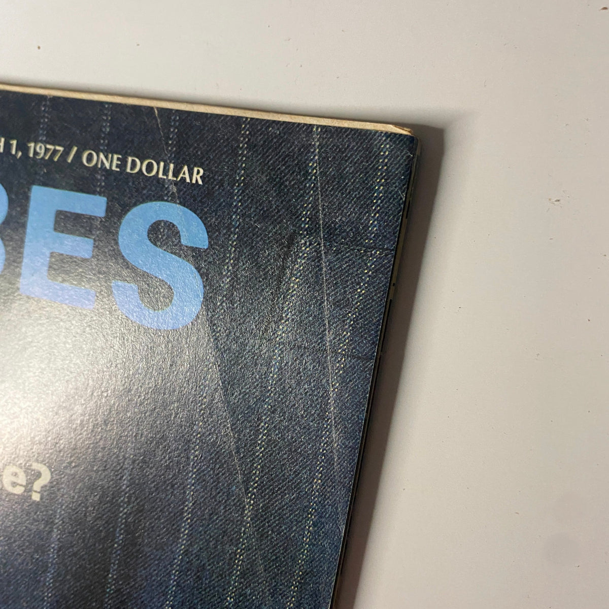 Side view of Forbes Magazine, March 1, 1977, showing the glossy cover and title.