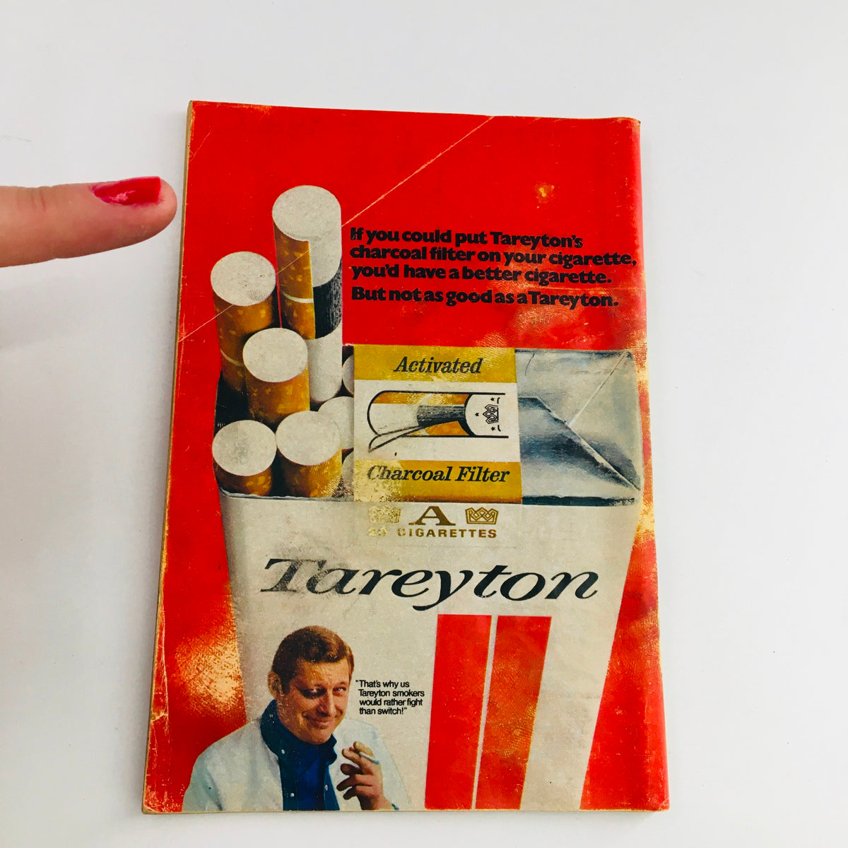Advertisement seen in TV Guide July 11, 1970 - Vol 18 #28 for Tareyton cigarettes, highlighting the charcoal filter concept with a visual of cigarette packaging.