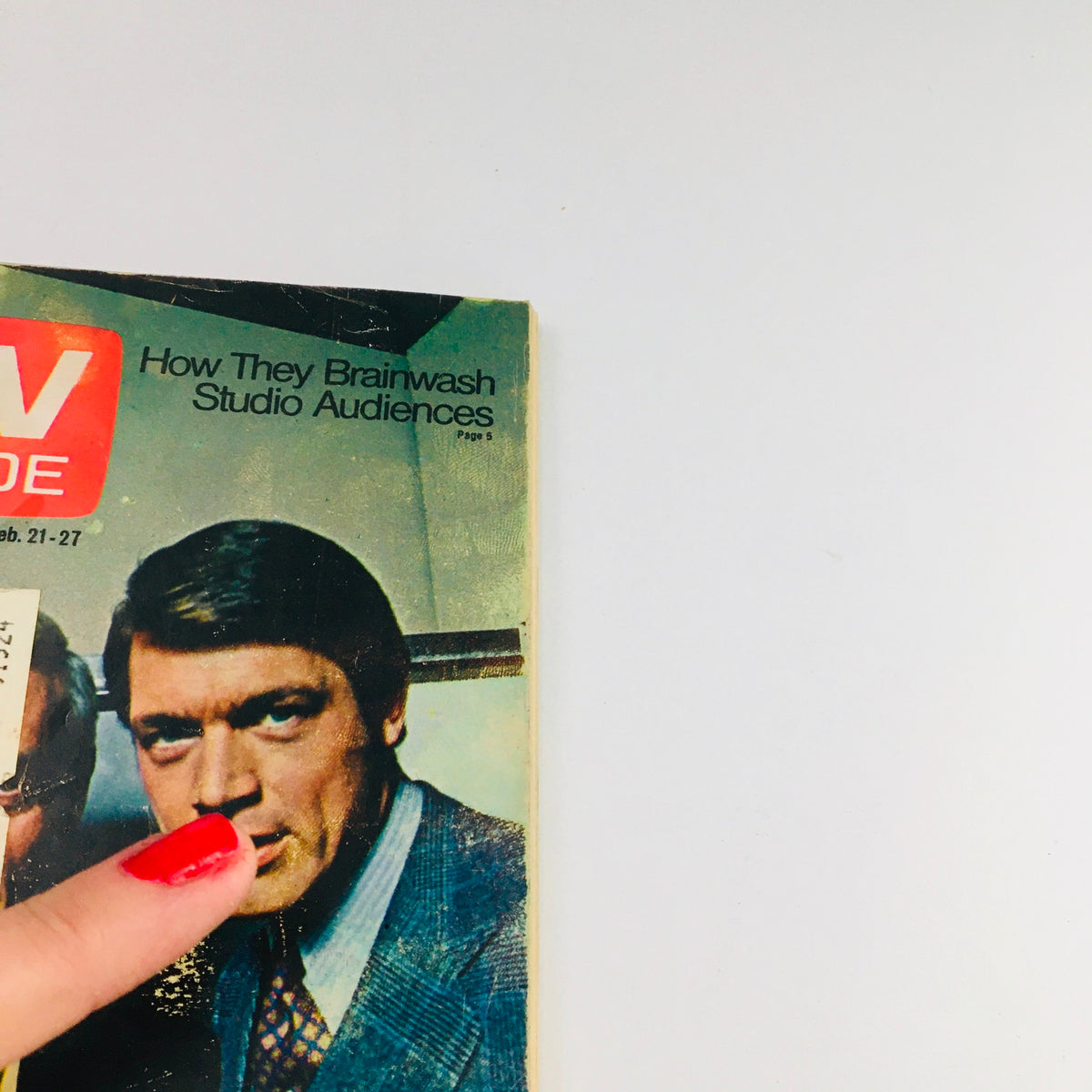 Close-up view of the TV Guide February 21 1970 cover featuring James Daly and Chad Everett, highlighting vintage television themes.