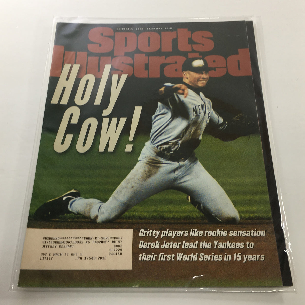 Cover of Sports Illustrated, October 21, 1998, featuring Derek Jeter, capturing his role in leading the Yankees to their first World Series in 15 years with the headline 'Holy Cow!'.