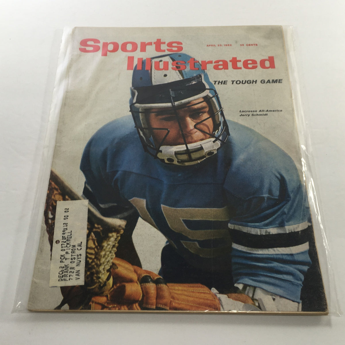Sports Illustrated cover from April 23, 1962, titled 'The Tough Game'. Featuring lacrosse player Jerry Schmidt, the magazine showcases a vintage sports theme with vibrant colors and historical relevance.