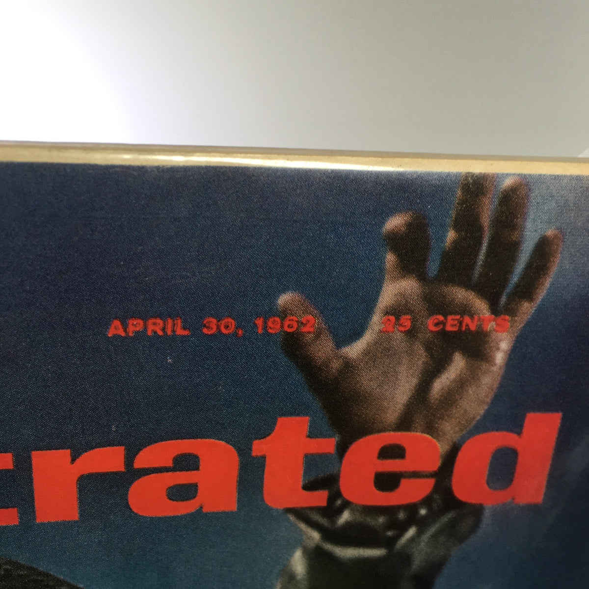 Close-up of the Sports Illustrated magazine cover dated April 30, 1962, showcasing the iconic title and price, reflecting its historical significance in sports journalism, particularly featuring Luis Aparicio.