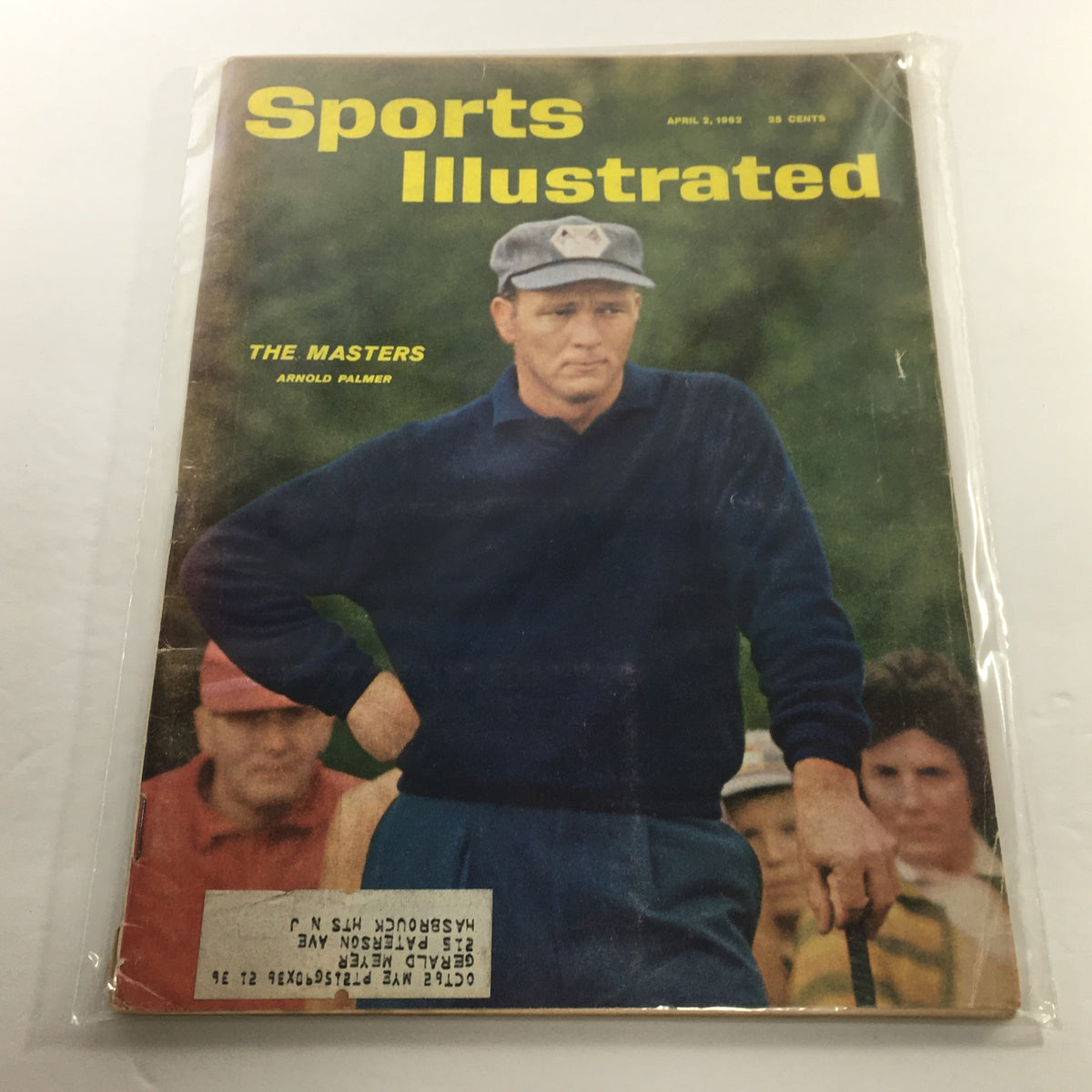 Cover of Sports Illustrated: April 2 1962 featuring Arnold Palmer at The Masters, showing him in casual golf attire with a composure-focused expression, protected by a plastic covering.