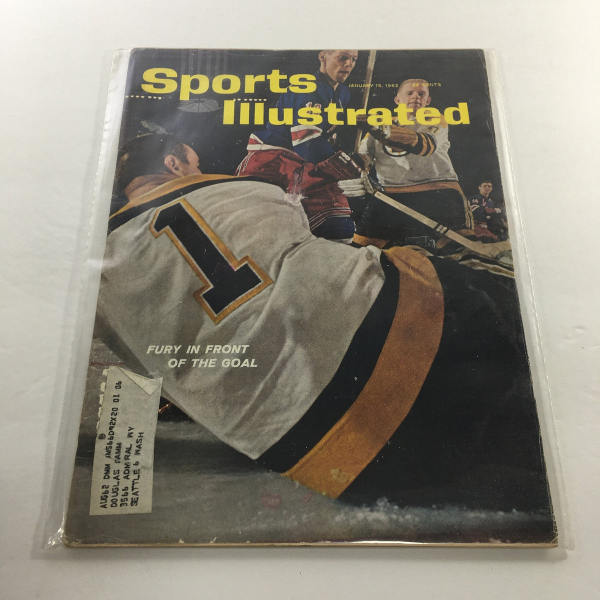 Cover of Sports Illustrated magazine, January 15, 1962, titled 'Fury In Front Of The Goal', featuring an intense ice hockey scene with players in action.