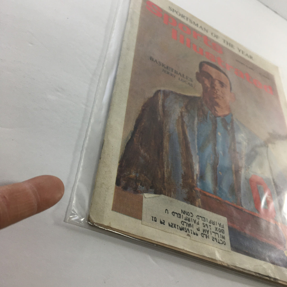 Sports Illustrated magazine from January 8, 1962, featuring Basketball's Jerry Lucas. The magazine is protected by plastic, indicating good condition with visible wear on the edges and a label on the front.