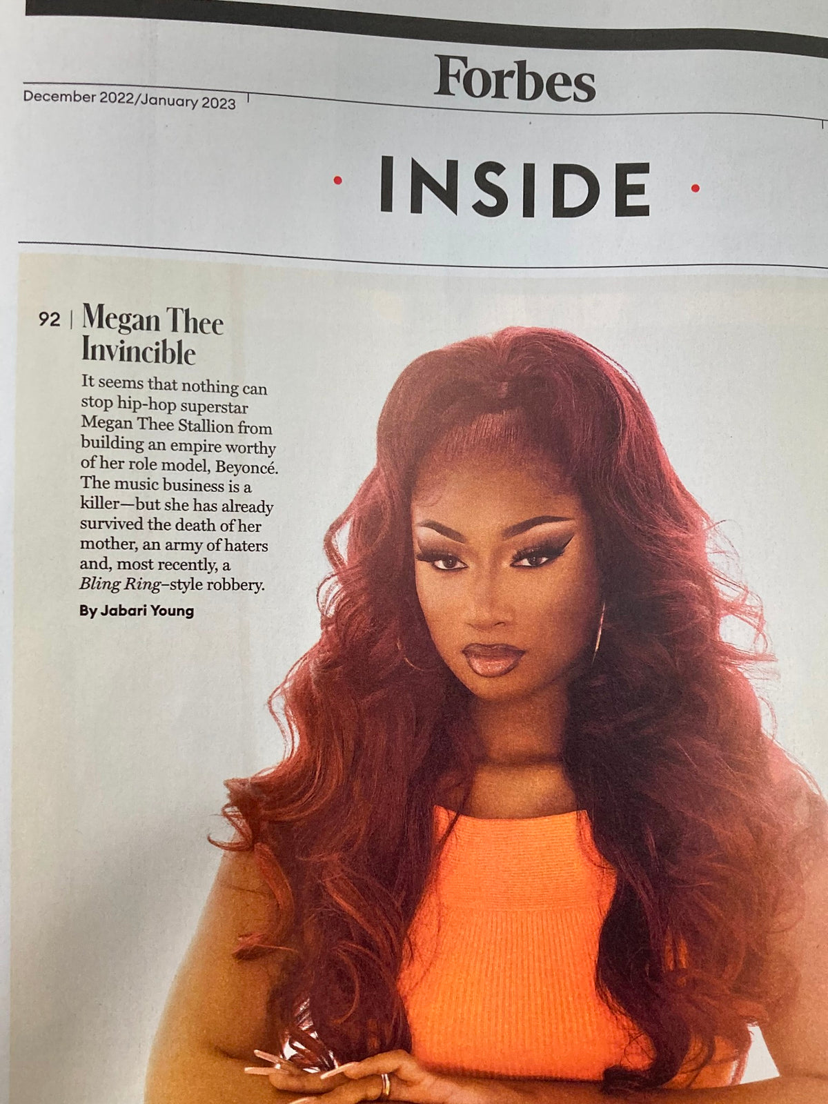 Forbes Magazine December 2022 featuring Megan Thee Stallion, showcasing her influence in hip-hop and examining her entrepreneurial journey in the music industry.