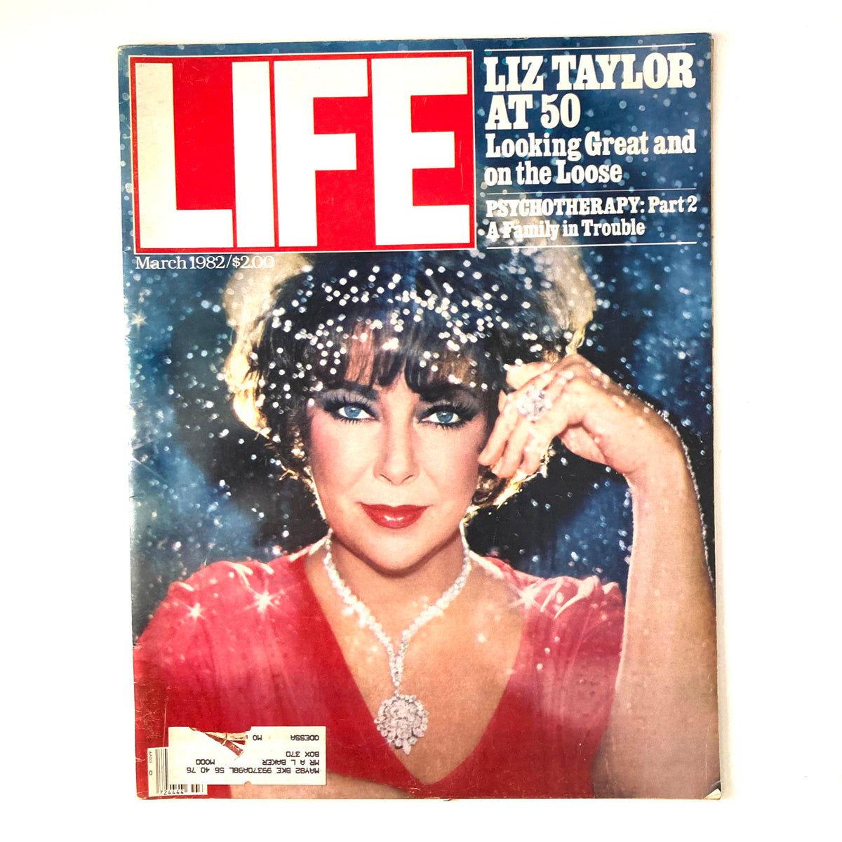 VTG Life Magazine March 1982 featuring Elizabeth Taylor at 50, capturing her glamorous look with sparkling background and elegant attire.