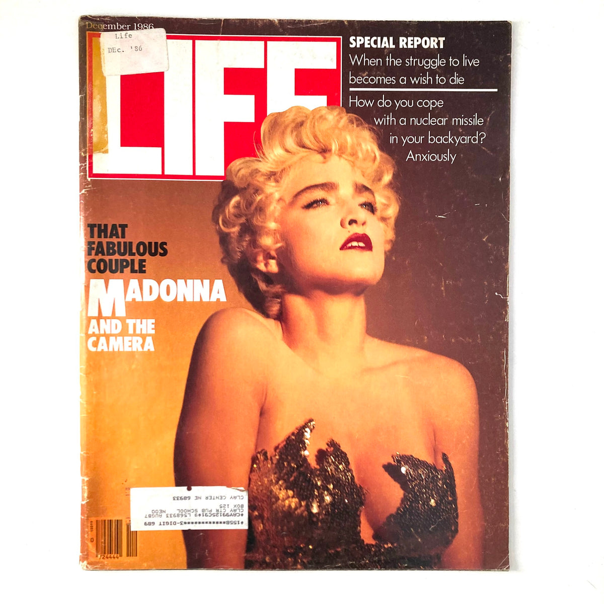 VTG Life Magazine December 1986 cover featuring Madonna, showcasing her portrait and the headline 'That Fabulous Couple: Madonna and The Camera' highlighting her iconic impact on pop culture.