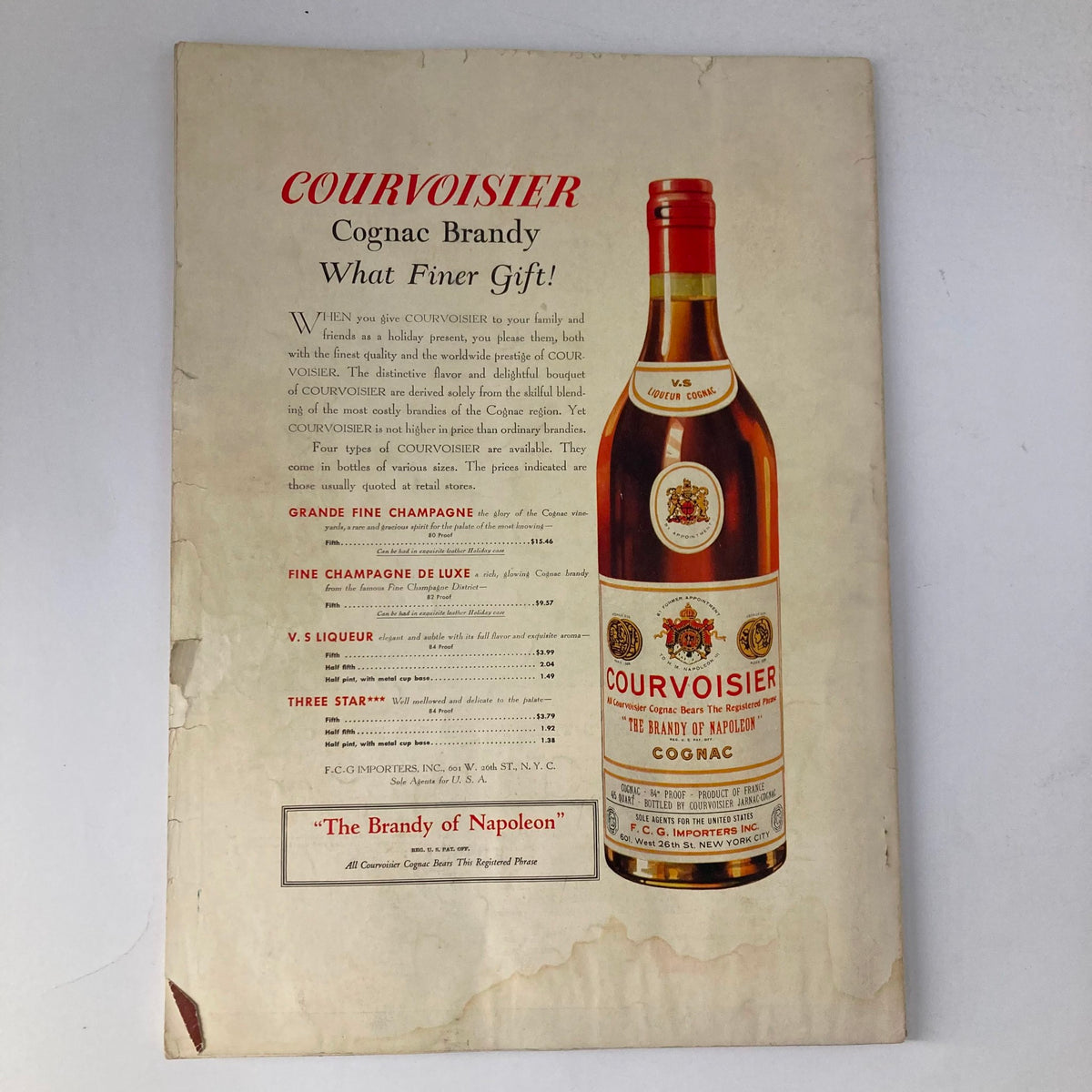 Vintage advertisement for Courvoisier Cognac Brandy, featuring a bottle on display and a description emphasizing quality and gift suitability from the VTG Stage Magazine December 1937.