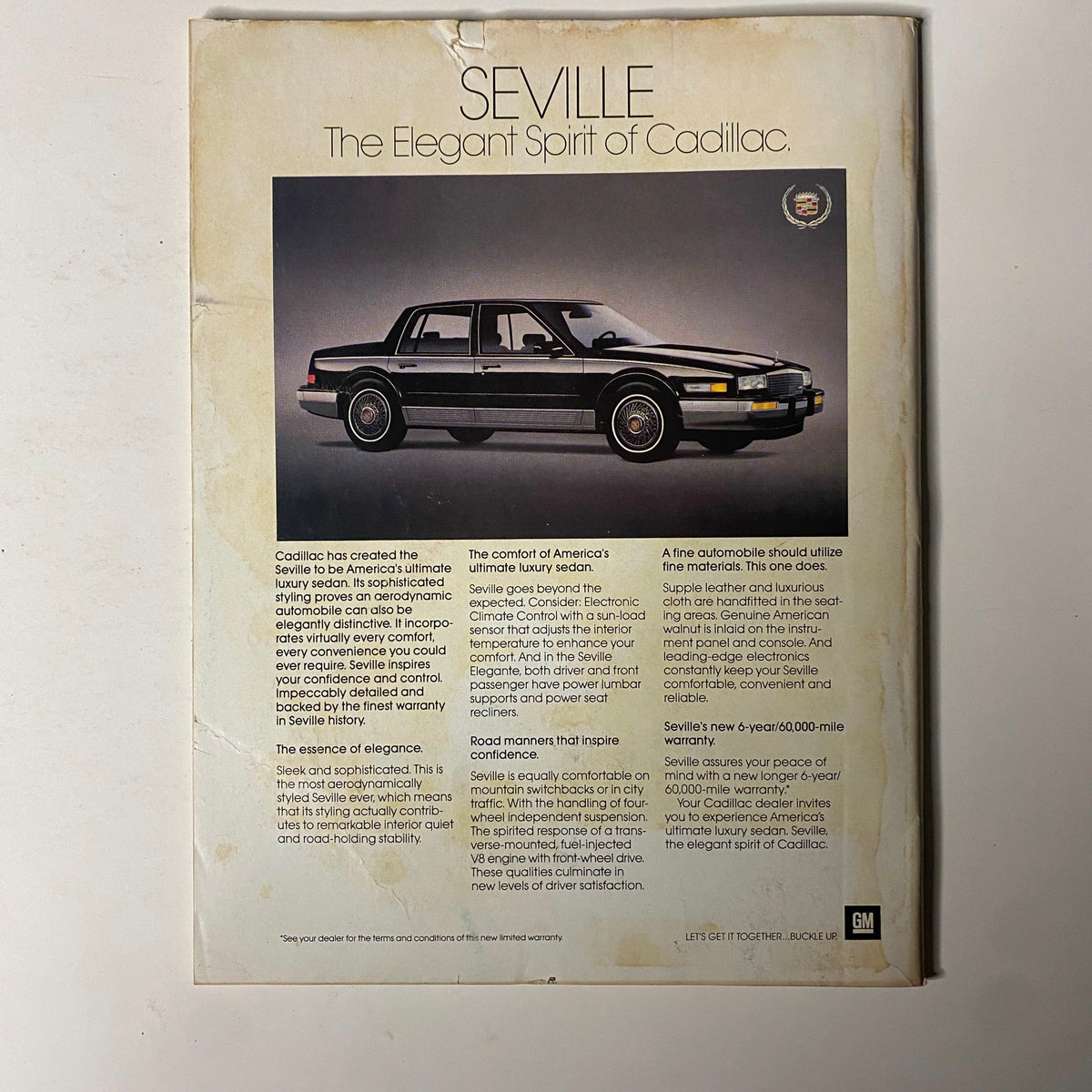 Back cover of Forbes Magazine April 20, 1987, featuring an advertisement for Cadillac Seville, emphasizing luxury and comfort.